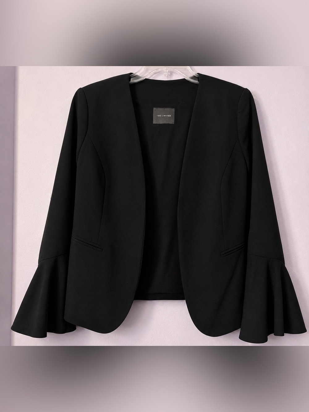 The limited black blazer with bell sleeves